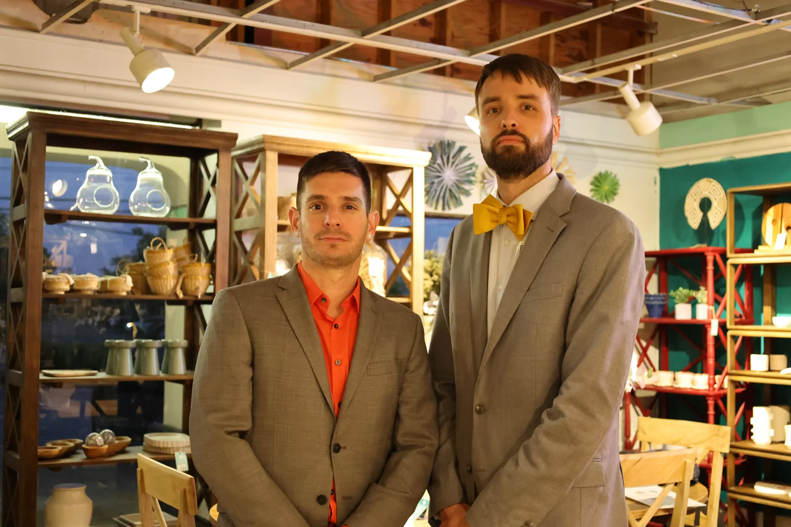 Two guests in suits at the Nadeau event