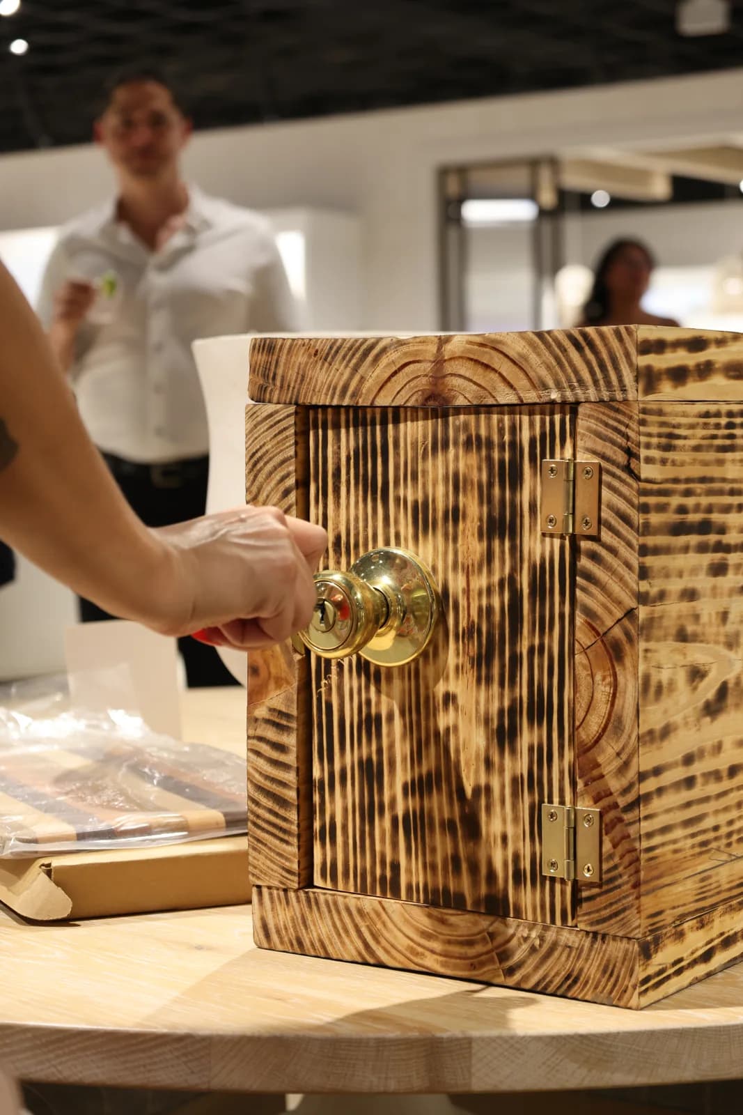 A guest holds the key ceremony box at Bassett