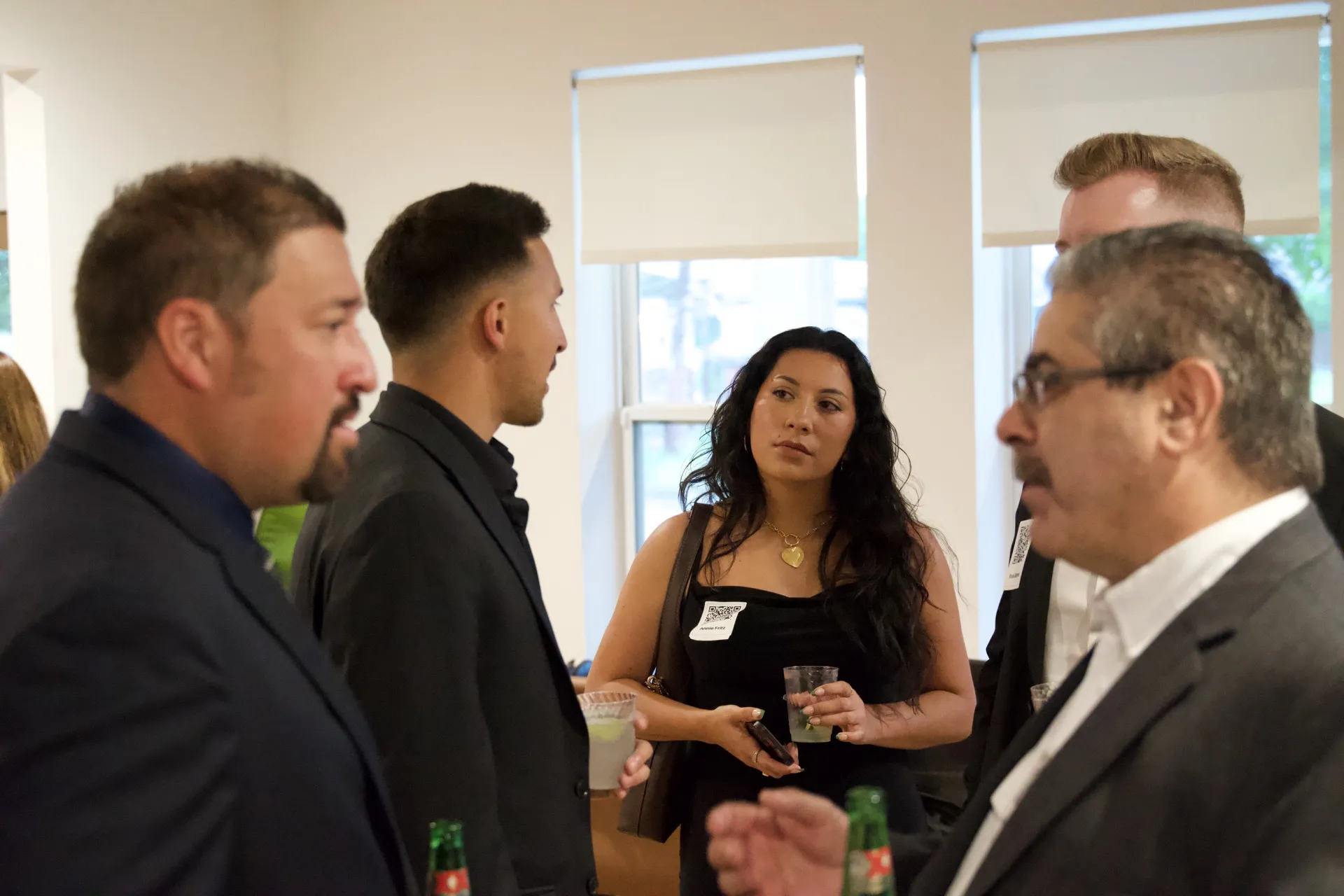 A group of Capitol Keys guests sharing a conversation at an event